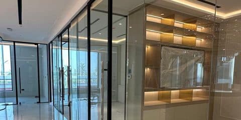 Finished glass partitions in a completed interior